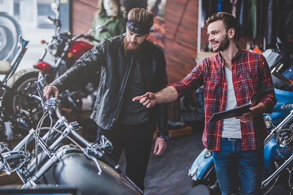 Men shopping for motorcycle